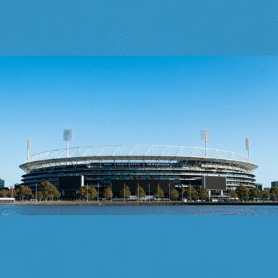 Melbourne Cricket Ground and Rod Laver Arena from a distance, with a clear blue sky